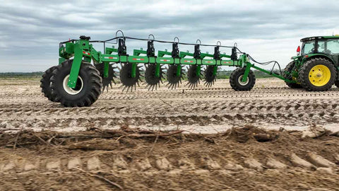 Harrell Ag Rock-N-Root Rake operating in field behind tractor