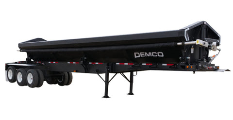 Demco triple axle side dump trailer with steel dump body and landing legs