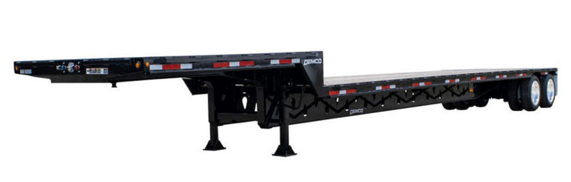 Demco tandem axle steel drop deck trailer with low-profile deck for hauling tall equipment