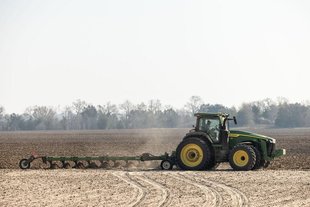 Harrell Ag on-land switch plow performing primary tillage in soil