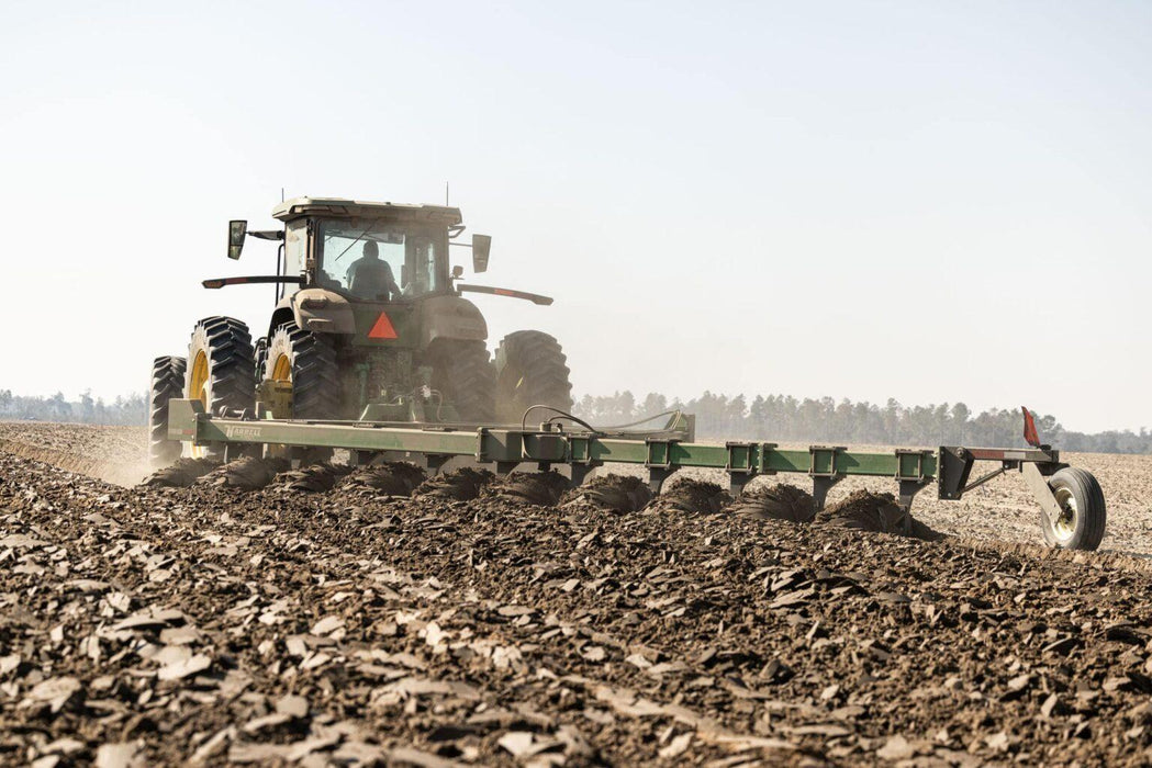 Harrell Ag on-land switch plow covering wide working width in field