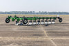 Harrell Ag on-land switch plow moving through cultivated soil