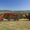 Side field view of Enorossi CR-850 basket bar rake during raking