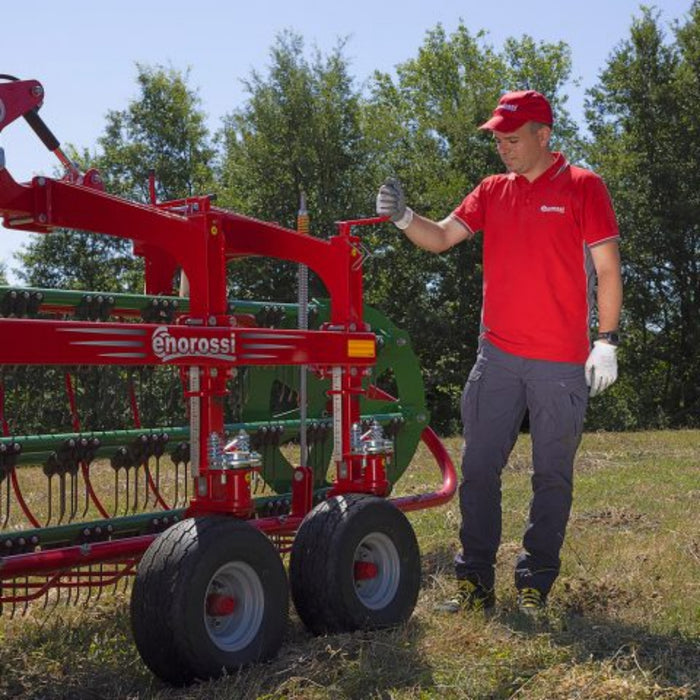 Operator standing beside Enorossi CR-850 basket bar rake