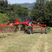 Enorossi CR-850 basket bar rake operating behind tractor
