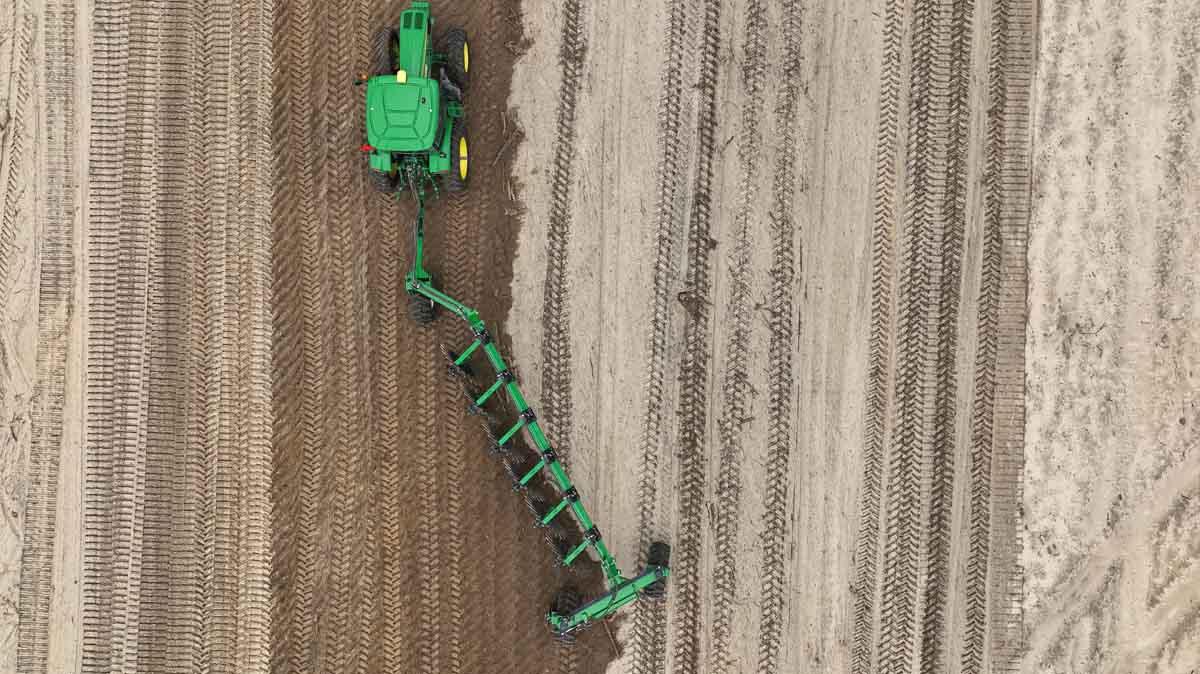 Harrell Ag Rock-N-Root Rake working across uneven terrain