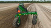 Harrell Ag Rock-N-Root Rake rear-mounted view during raking