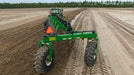 Harrell Ag Rock-N-Root Rake rear-mounted view during raking
