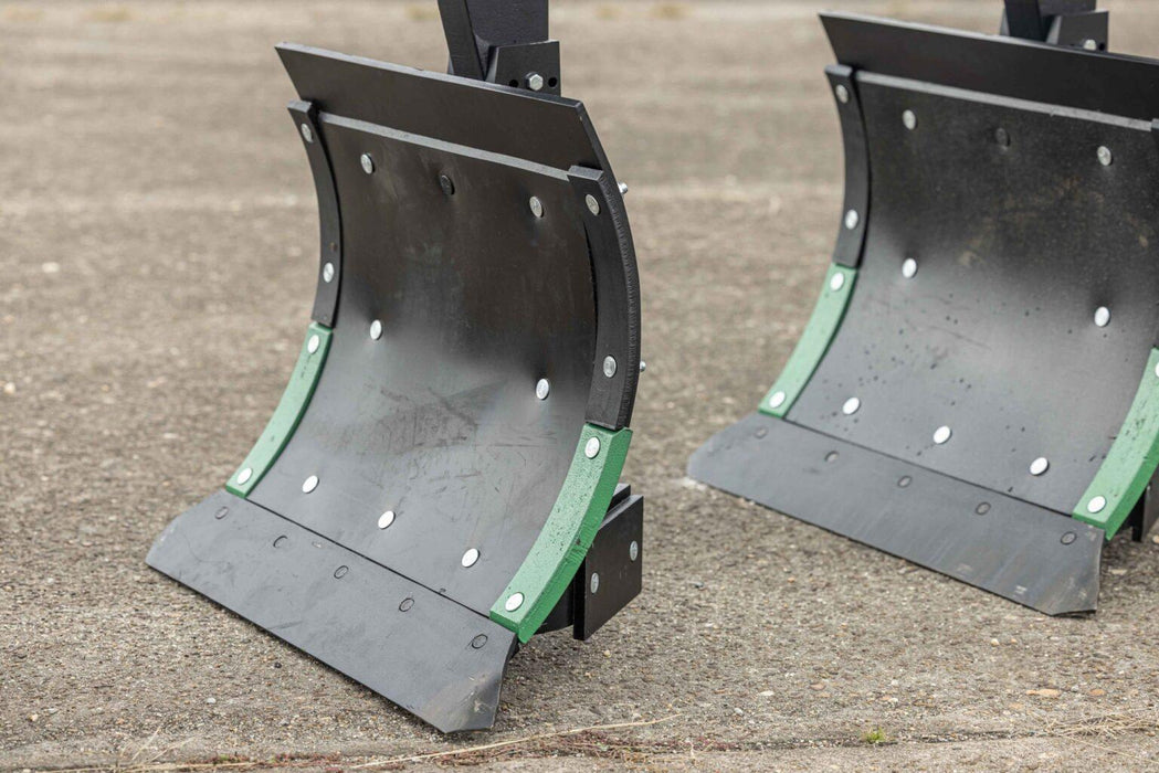 Harrell Ag In-Furrow Land Plow 9400 moldboard bottoms with wear strips, tractor-mounted tillage plow components.
