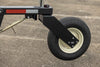 Harrell Ag In-Furrow Land Plow 9400 depth gauge wheel assembly with tire and mounting arm for tractor tillage.