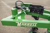 Harrell Ag In-Furrow Land Plow 9400 main frame and hydraulic linkage with Harrell Ag branding for tractor tillage.