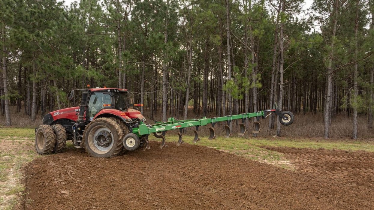 Harrell Ag On-Land Switch Plow 6508 HD attached to tractor during operation
