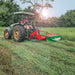 Tractor operating Enorossi BT rotary drum mower in pasture field