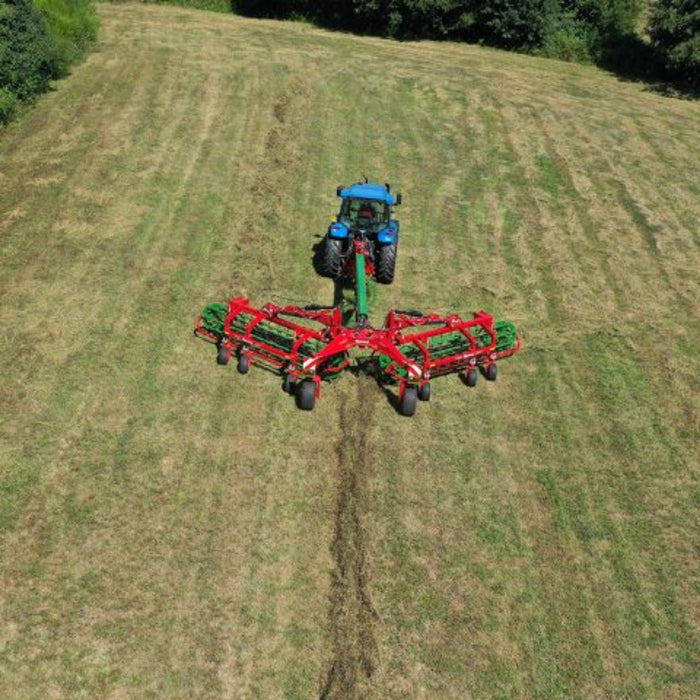 Long-distance field view of Enorossi CR-850 basket bar rake