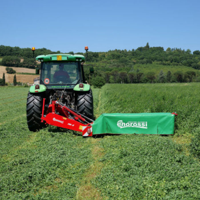 Tractor mowing with Enorossi disc mower DM in open field