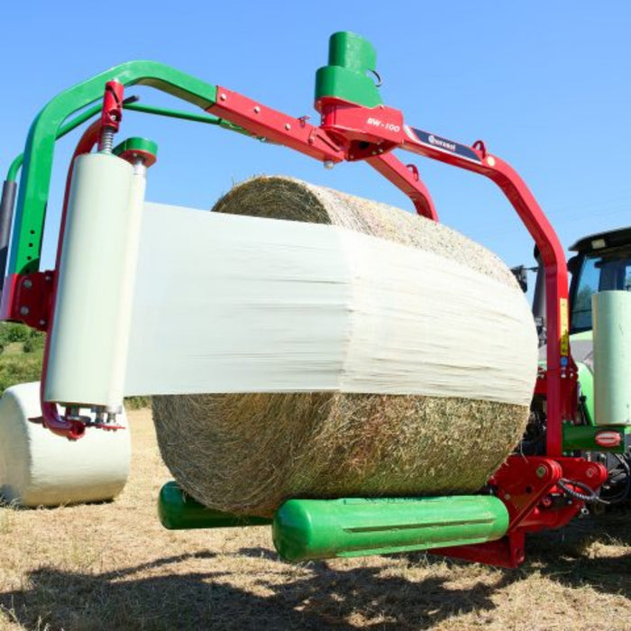 Close view of wrapped round bale on Enorossi BW bale wrapper