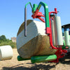 Side angle of Enorossi BW bale wrapper during silage wrapping