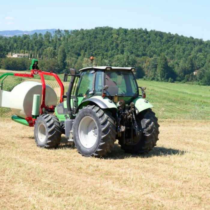Enorossi BW mounted bale wrapper attached to tractor during wrapping