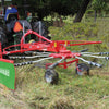 Enorossi RR 320 single rotor rake forming windrow in hay field
