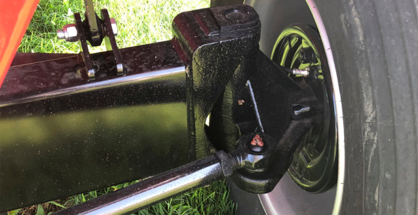 Torsion bar suspension and axle detail on Demco 750 SS grain wagon