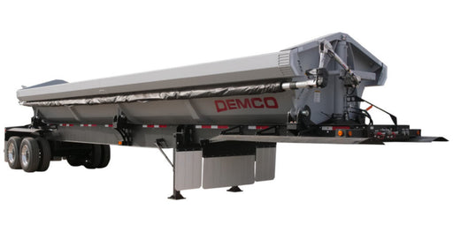 Demco tandem axle side dump trailer with steel dump body and landing legs