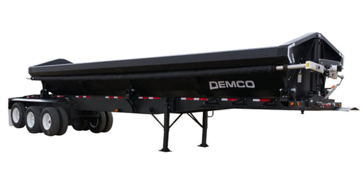 Demco triple axle side dump trailer with steel dump body and landing legs