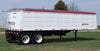 Demco steel hopper-bottom grain trailer rear angle showing hopper and axles