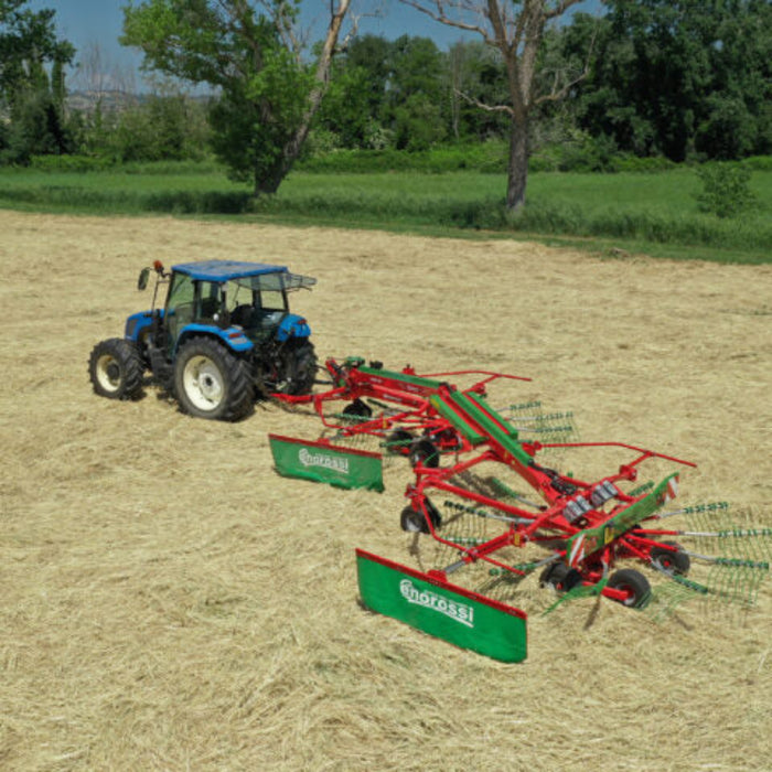 Enorossi TRACER 780 double rotary rake forming side swath during operation