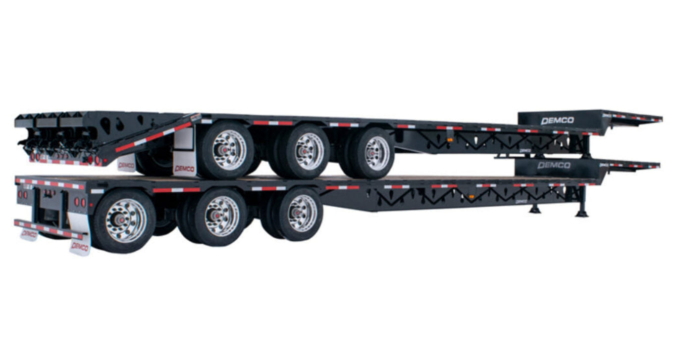 Side view of Demco triple axle steel drop deck trailer