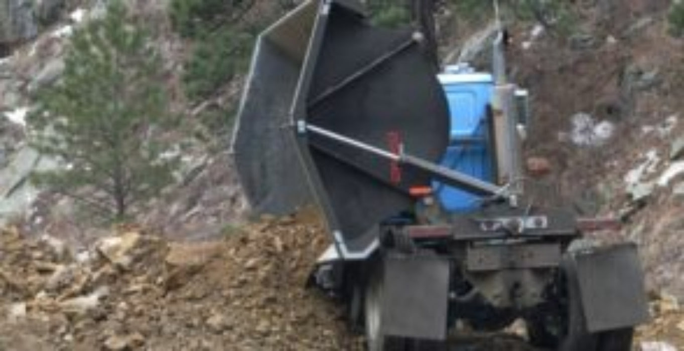 Demco side dump truck box operating on construction job site