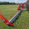 Tractor-mounted Enorossi double action sickle bar mower cutting hay along field edge