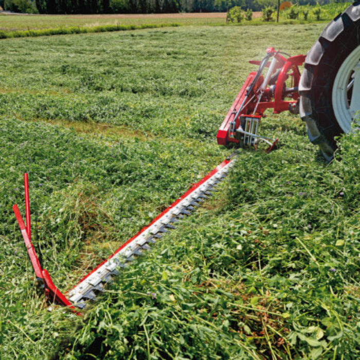 Rear view of Enorossi BF/BFS sickle bar mower attached to tractor in pasture