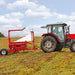 Enorossi BW-300 trailed bale wrapper operating behind tractor in field