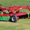 Rear angle of Enorossi DMC TREX disc mower with conditioner during operation