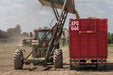 Harrell Ag Drying Van being lifted with equipment during placement