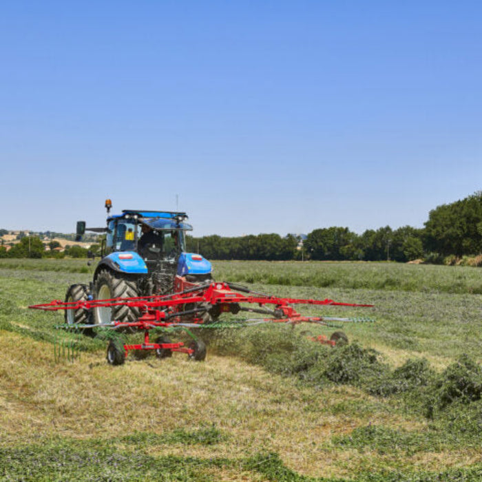Enorossi ENODUO 610 double rotor hay rake attached to tractor in field