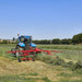 Enorossi ENODUO 610 double rotor hay rake attached to tractor in field