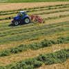 Enorossi ENODUO double rotor hay rake working across cut hay rows