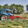 Enorossi ENODUO 650H double rotor rake operating on uneven terrain