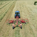 Enorossi ENODUO 780 double rotary hay rake forming central windrow in field