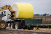 Harrell Ag Module 8 Express cotton module trailer loaded with round cotton module during harvest