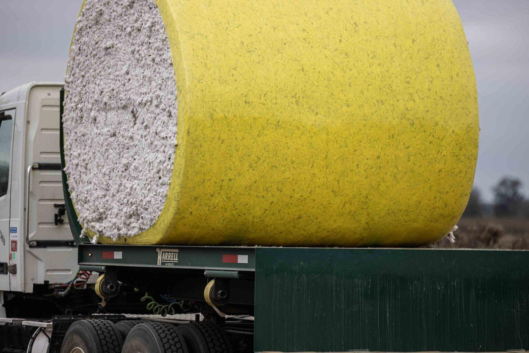 Harrell Ag Module 8 Express cotton module trailer carrying a round cotton module