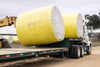 Harrell Ag Module 8 Express cotton module trailer being loaded with round cotton modules using a telehandler