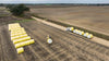 Harrell Ag Module 8 Express cotton module trailer transporting round cotton modules during harvest operations