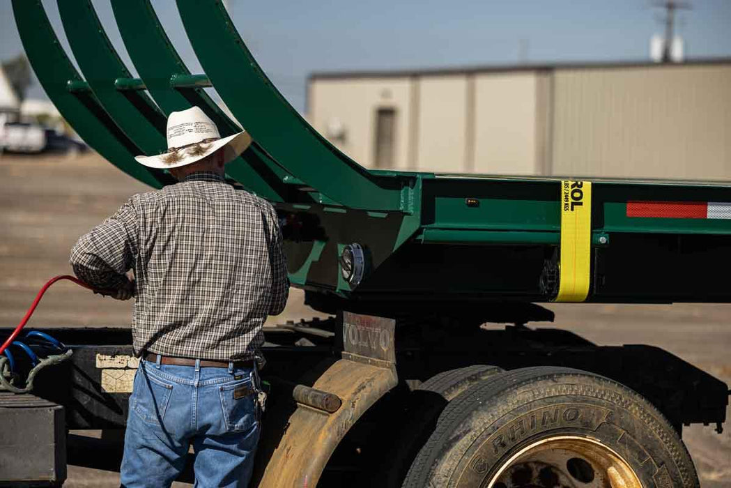 Harrell Ag Module 8 Express cotton module trailer with hydraulic ramp raised during loading