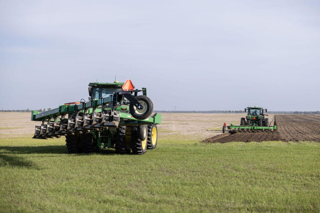 Harrell Ag on-land switch plow viewed from rear during tillage pass