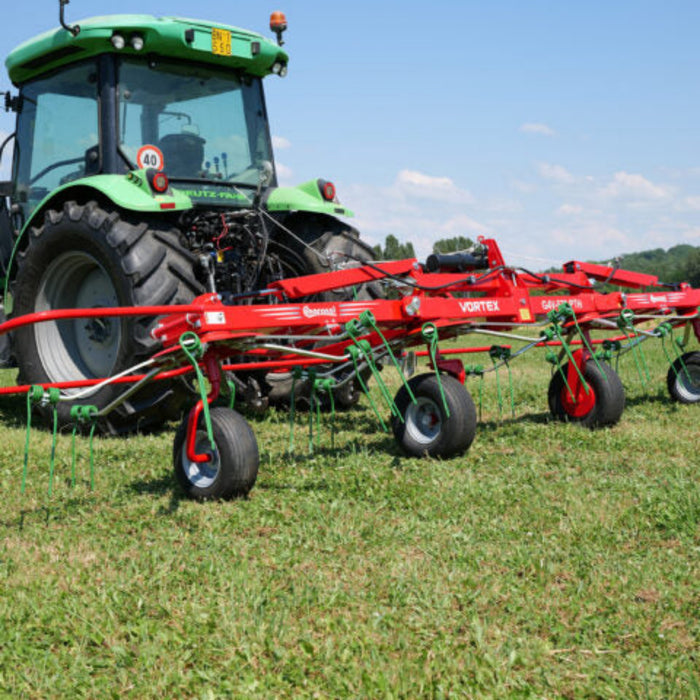 Tractor-mounted Enorossi VORTEX G4 rotary tedder spreading forage