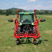 Wide field view of Enorossi VORTEX G4 rotary hay tedder spreading hay