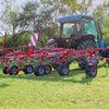 Enorossi VORTEX G6 hay tedder operating behind tractor in forage field