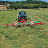 Enorossi VORTEX G6-740 PROFILINE hay tedder operating behind tractor in field